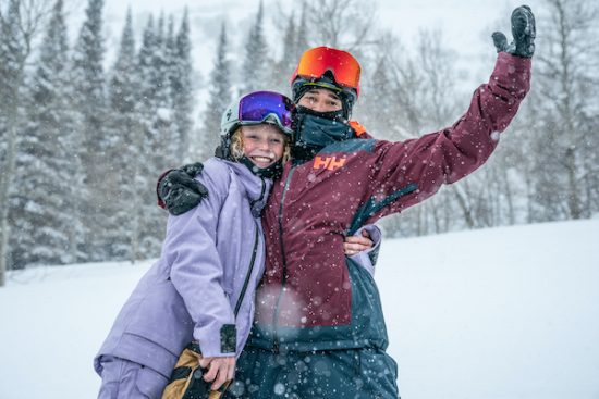 two happy people in snow